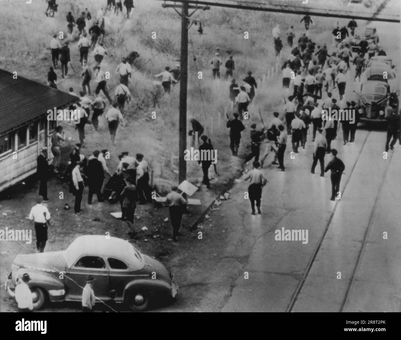 Police Charge Pickets A score of men on picket line duty in the