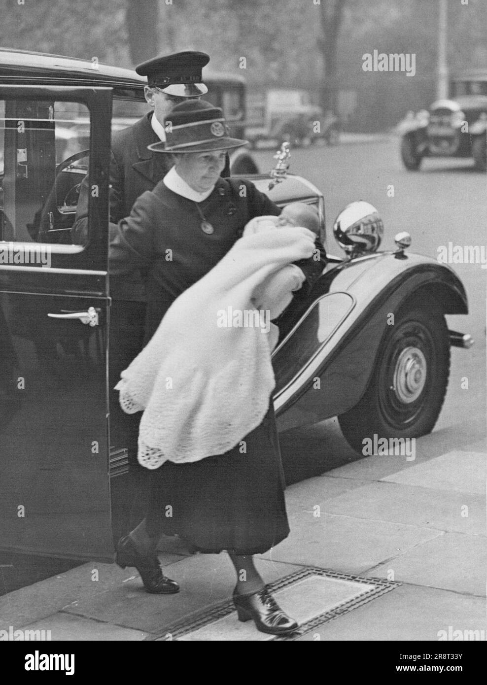 New Royal Baby Goes Out - The infant son of the Duke and Duchess of Kent being carried by his nurse of returning to No.3, Belgrave Square after an outing. October 30, 1935. (Photo by London News Agency Photos Ltd.). Stock Photo