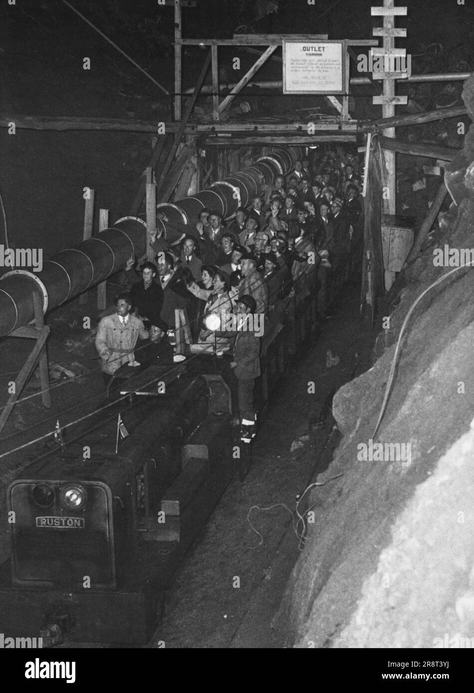 Diesel-drawn trolley train coming out of the Guthega-Munyang tunnel after its maiden journey on Friday night. May 11, 1954. Stock Photo