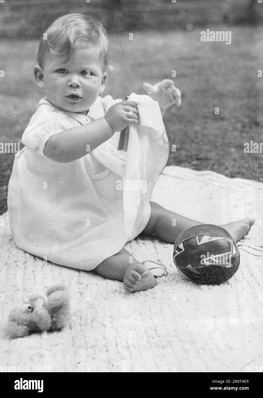 Prince Michael's First Birthday - Prince Michael, younger son of the Duchess of Kent and the late Duke, will be one year old on Sunday, *****. The photograph was taken at Coppins, Iver, ***** to mark the happy event, and shows Prince Michael playing on the lawn. June 30, 1943. Stock Photo