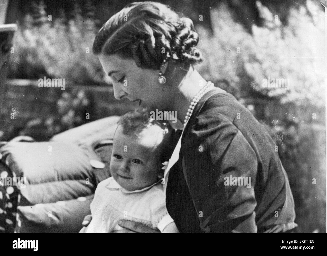 A Royal Mother And Her Baby: This is the first picture to be taken of the Duchess of Kent and her little eight months old son, Prince Edward, at their home, 'Coppins'. Iver, Buckinghamshire. June 30, 1936. Stock Photo