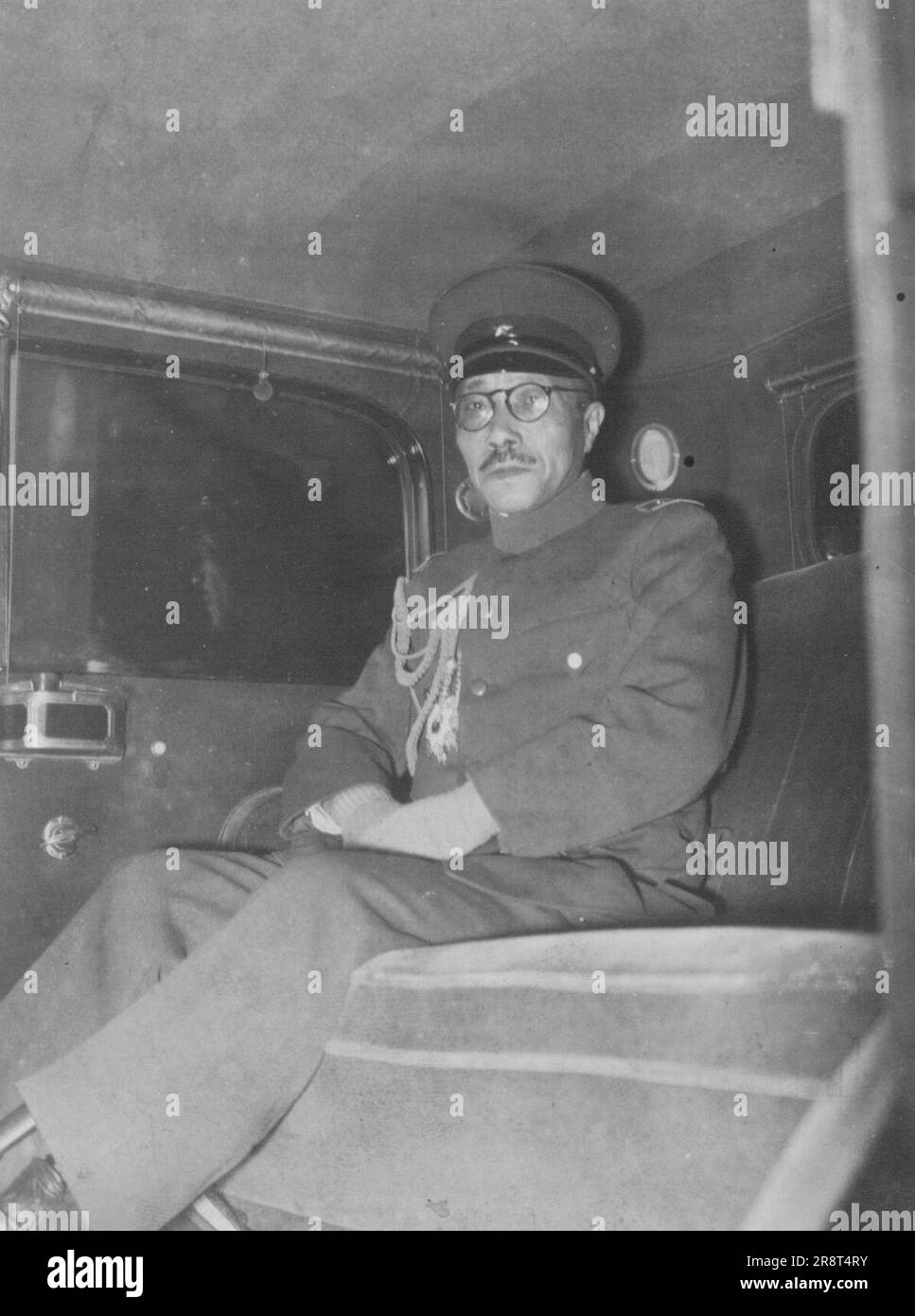 Chief of the Staff ... Lieutenant General Hideki Tojo, Chief of the staff of the Japanese troops in Manchuria, is seen as proceeding to the Imperial Palace today in order to report to the Throhe ... He returned here from Manchukuo recently. April 01, 1938. (Photo by The Domei News Photos Service). Stock Photo