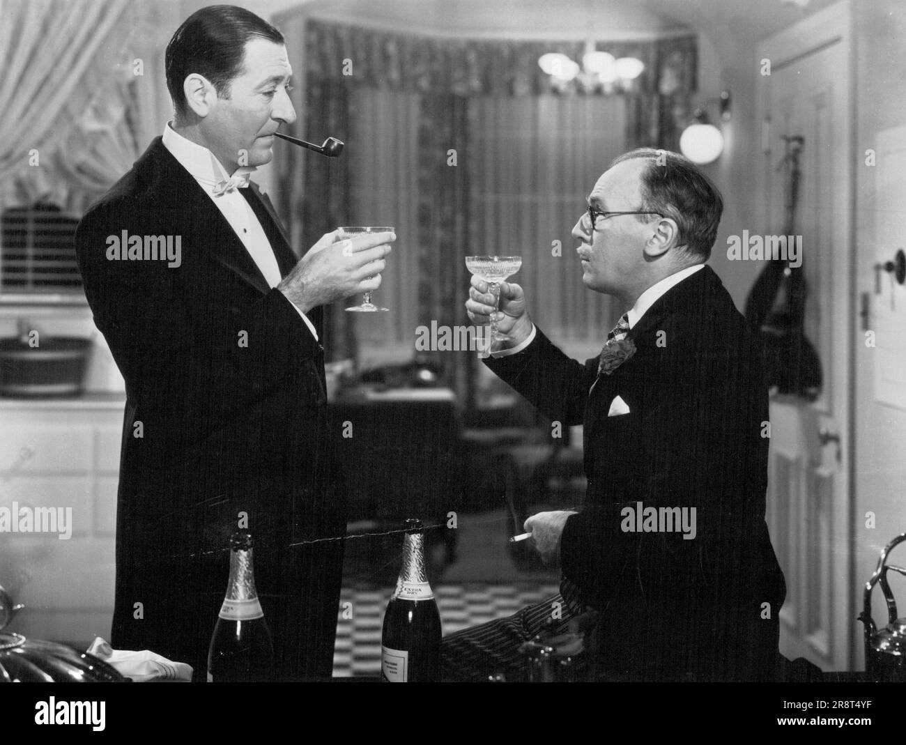 Arthur Treacher and Roland Young Are Shown Here in a Scene From RKO Radio's 'Irene,' delightful comedy with music starring Anna Neagle in the tuitle role. Ray Milland, Alan Marshal, Young, May Robson, Billie Burke and Treacher are featured in this screen version of the Smash-hit stage production which created a sensation on Broadway. November 12, 1940. Stock Photo