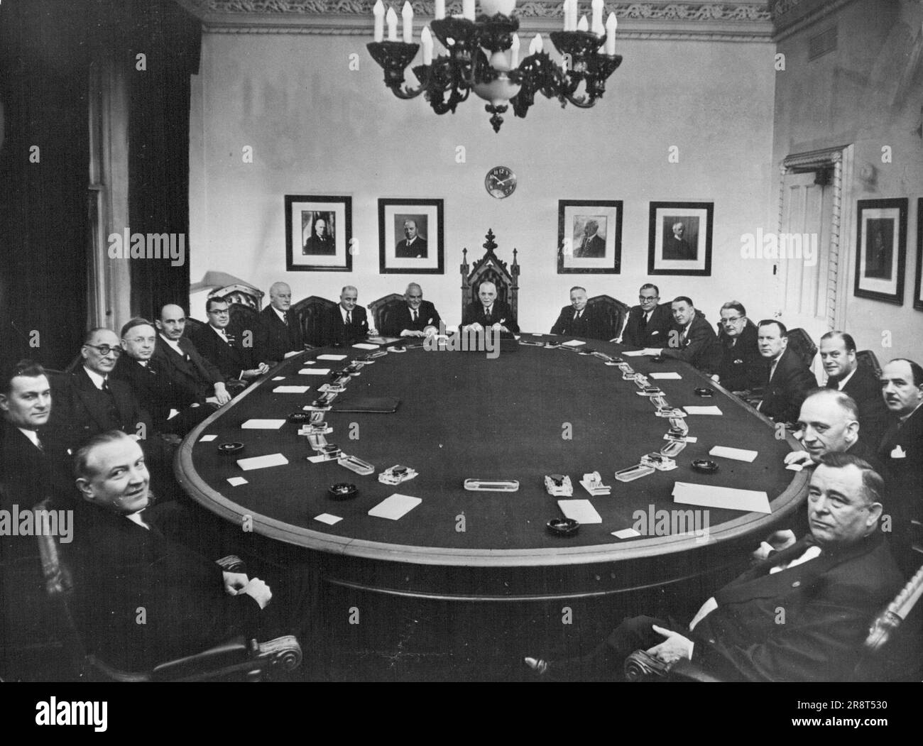 The Canadian Cabinet - Clockwise from bottom left hand corner:- Alcide Cote, Postmaster General; Walter Harris, Minister of Citizenship and Immigration; F. Gordon Bradley, Secretary of State; Stuart Garson, Minister of Justice and Attorney General; Milton Gregg, Minister of Labour; Paul Martin, Minister of National Health and Welfare; James McCann, Minister of National Revenue; Alphonse Fournier, Minister of Public Works; Clarence D. Howe, Minister of trade and Commerce and of Defence Production; Louis St. Laurent, Prime Minister and President of the Privy Council; James G. Gardiner, Mini… Stock Photo