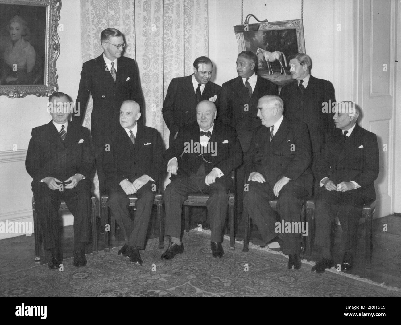 Commonwealth Conference Opens - The conference of Commonwealth Prime Minister opened this afternoon at No. 10. Out pictures shows, standing L to R. Mr. C. R. Swart (Sth. African Min. of Justice), Mr. Mohammed Ali (Pakistan), Sir John Kotelawala (Ceylon) and Sir Godfrey Huggins (central Africa). Seated L to R. Mr S.C. Holland (New Zealand), Mr. L. St. Laurent (Canada), Sir Winston, Mr. R.G. Menzies (Australia) and Mr. Nehru (India). January 31, 1955. Stock Photo