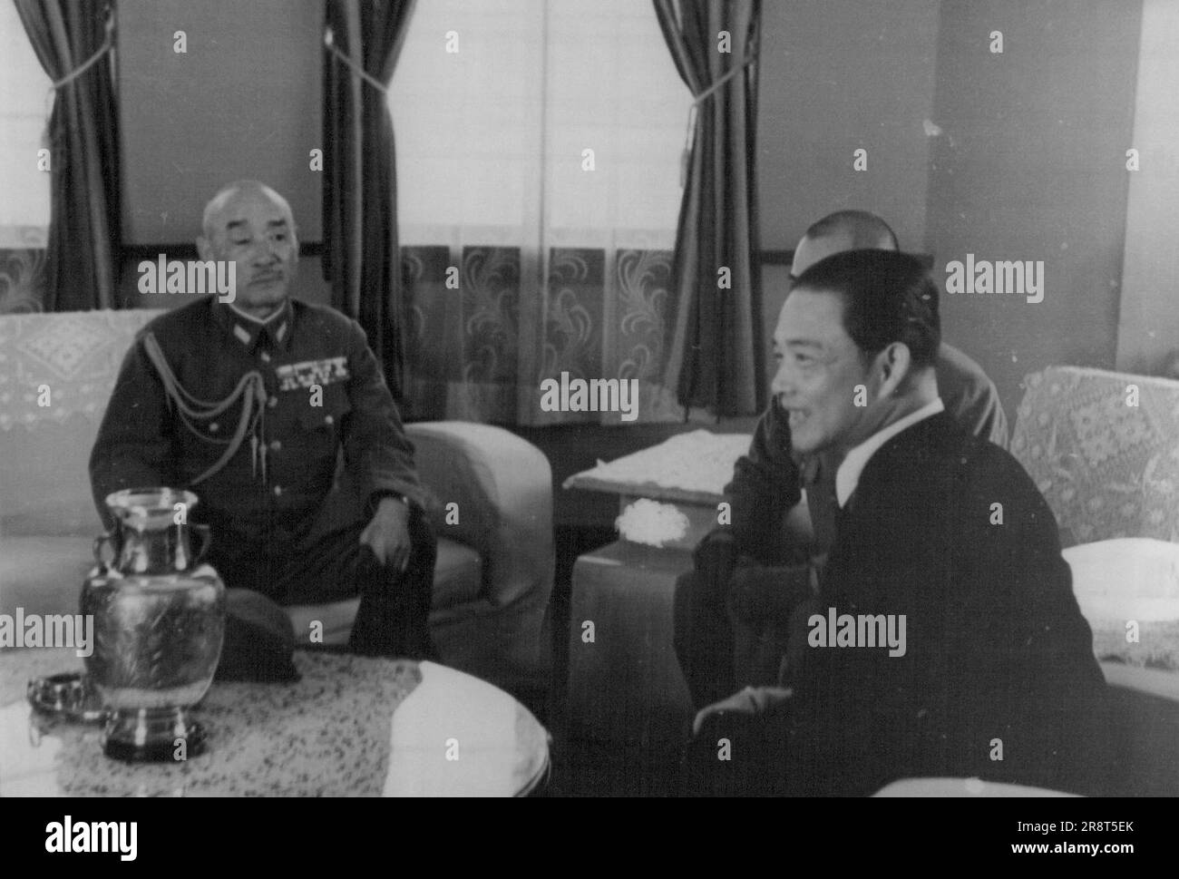 Tokyo... Sugiyama Returns from Naking.. General Gen. Sugiyama, chief of the Army Staff, who has been inspecting the battle fronts in China, during which he also conferred in Nanking with Mr. Wang Chingwei, right, returned to Tokyo today. November 6, 1940. (Photo by The Domei News Photos Service). Stock Photo