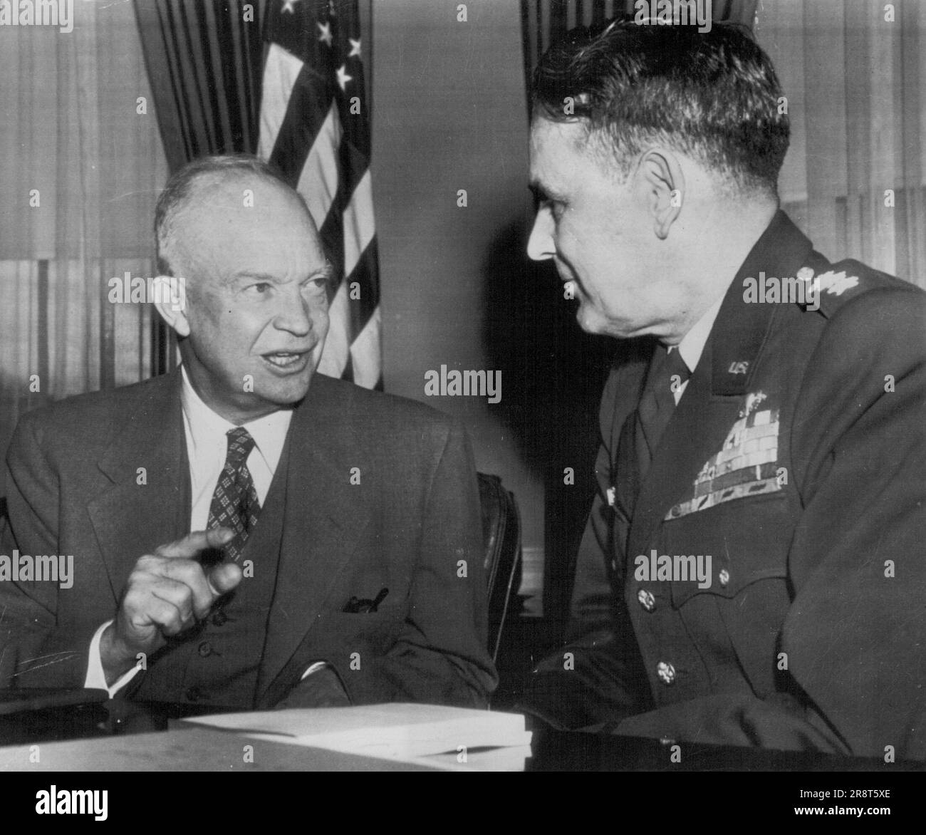 Eisenhower Confers With Taylor -- President Eisenhower Talks today with Lt. Gen. Maxwell D. Taylor, chosen yesterday to take Command of the Eighth Army in Korea. Taylor will succeed Gen. James A. Van Fleet, who is retiring. Mr. Eisenhower and General Taylor when he was Chief-of-Staff of the U.S. Army. General Maxwell D. Taylor, appointed by President Kennedy this week to he his personal military adviser, does not fit the popular image of the professional soldier as an inarticulate man of narrow interests. The 59-year-old, six-foot, four-star General is as much at home with the an cient Gr… Stock Photo