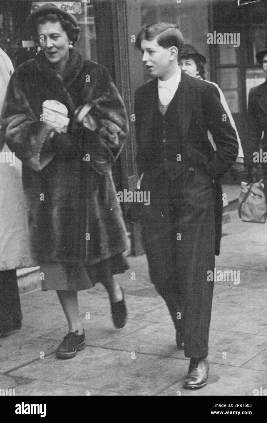 Shoppers - Wearing the traditional Eton ***** Duke of Kent goes Christmas shopping in ***** with his mother, the Duchess of Kent. The Royal pair mingled with shoppers unnoticed. December 17, 1949. Stock Photo