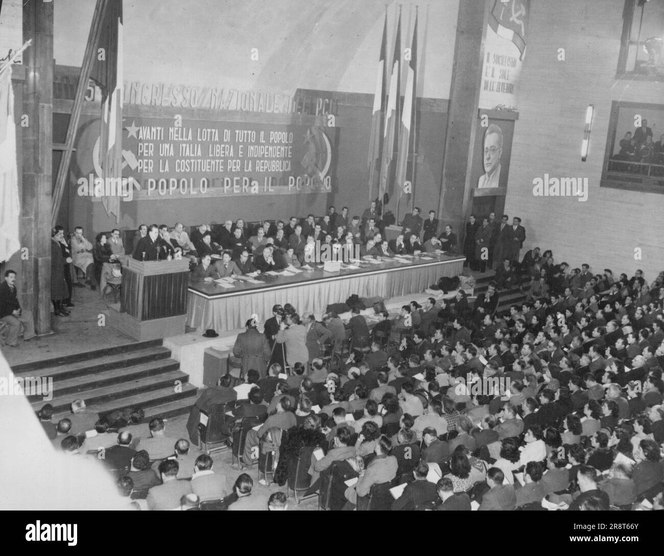 Communist Party Meets in Rome -- General view of the opening of the Fifth Annual Italian Communist Party's National Congress which opened Dec. 29 in Rome. Palmiro Togliatti, leader, speaks from the rostrum, left. January 10, 1946. (Photo by Associated Press Photo). Stock Photo