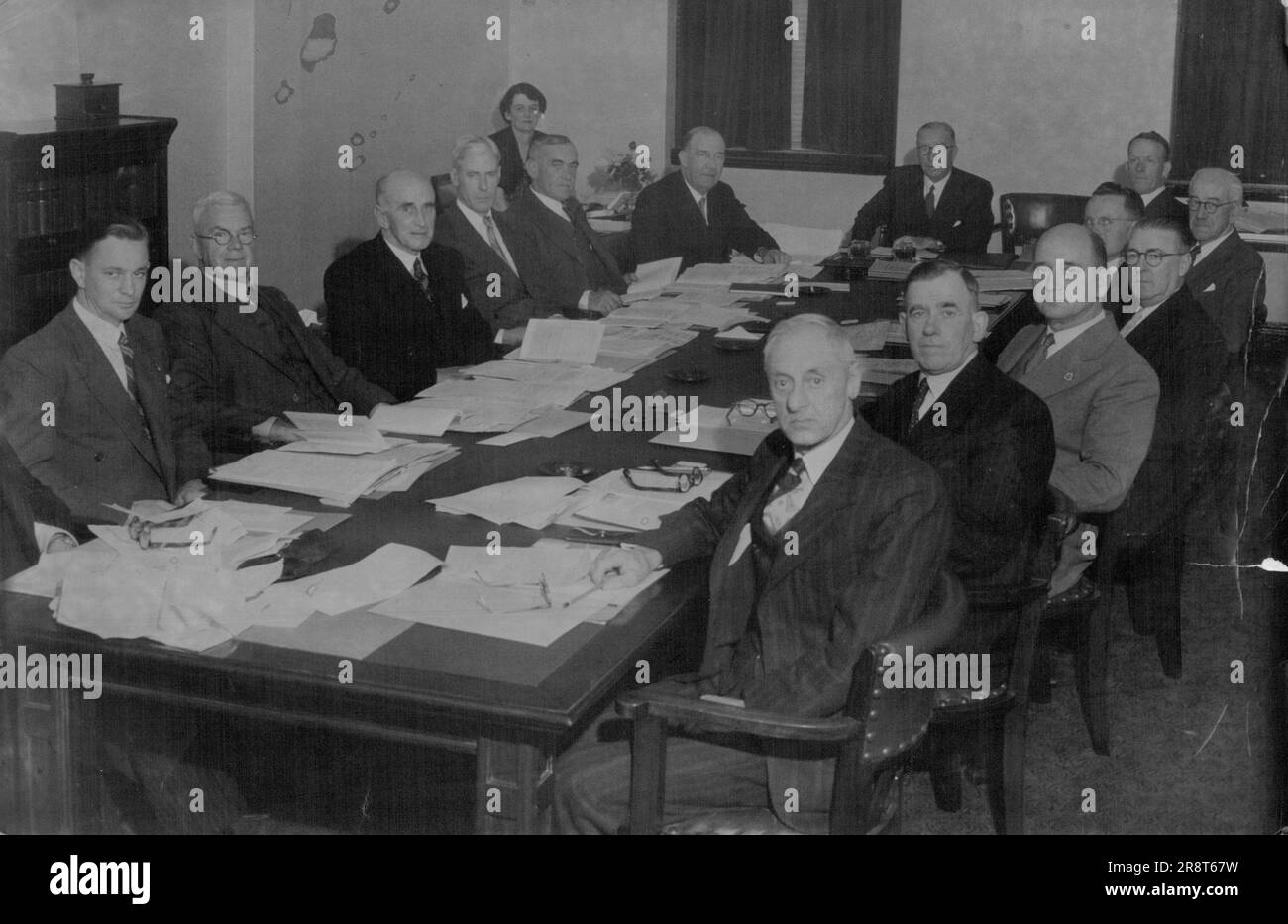 First Meeting. Conferring for the first time in Sydney are shown members of the Associated Stock Exchange. Round conference table from left: W. S. Holder and C. Bowly (Brisbane); H. C. Collingwood, W. I. Potter, G. D. Brown and R. A. Rowe (Melbourne); F. E. Tilley. chairman (Sydney); A. G. Wallace, H. Maxwell, and K. J. Polkinghorne (Sydney); L. H. Laidlaw and R. B. Brindal (Adelaide); R. A. Chandler and W. C. Burrows (Hobart). April 18, 1951. Stock Photo