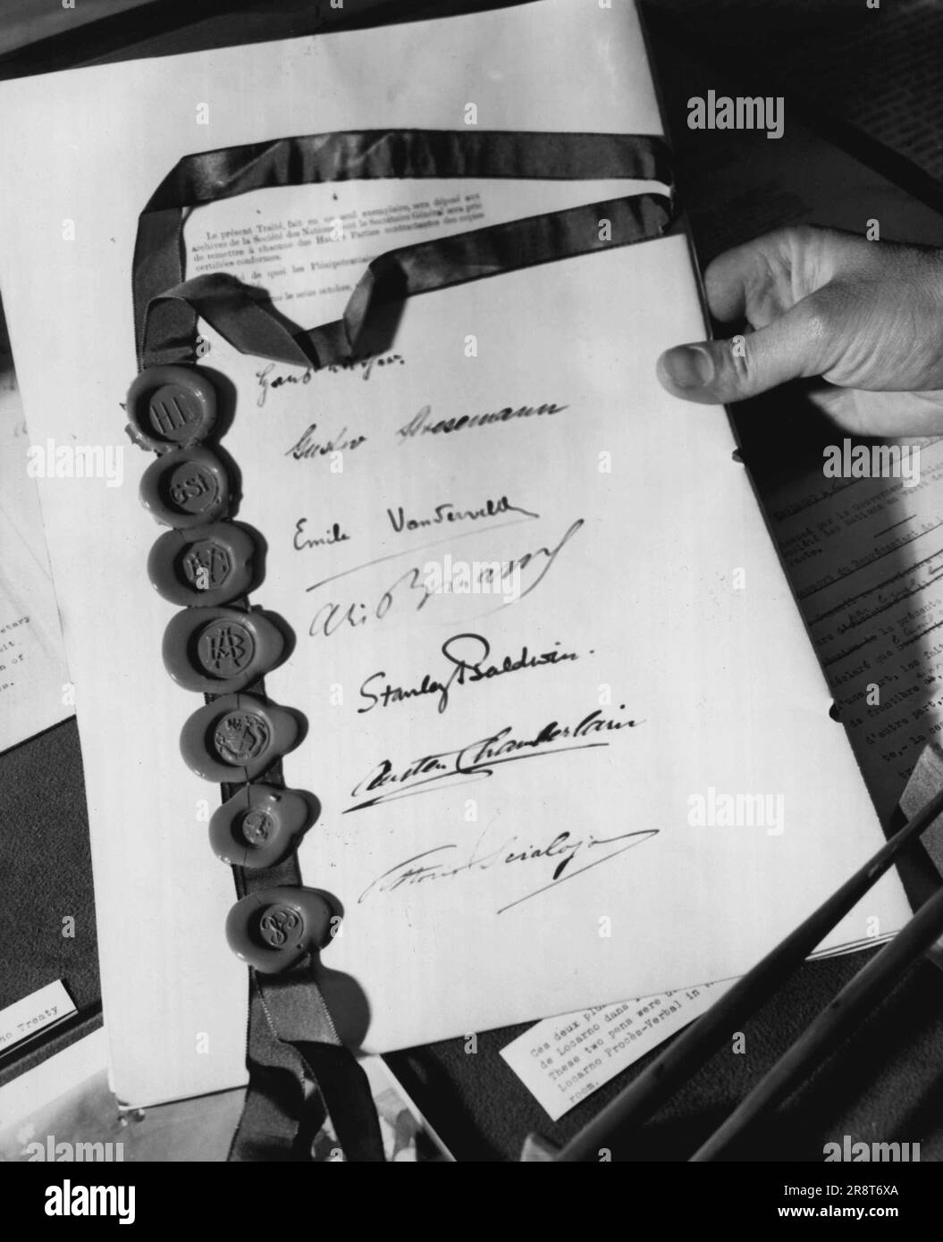 Library Of The Nations -- This signature page of the treaty of locarno is one of the documents in the library's collection. It was signed in 1925 by delegates from Belgium, Czechoslovakia, England, France, Germany, Italy and Poland. May 28, 1954. (Photo by United Press). Stock Photo