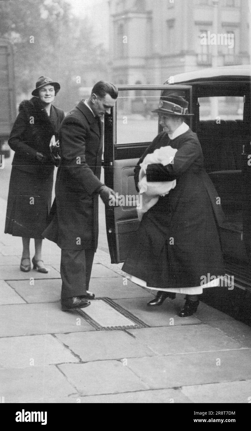First Picture Of Duchess of Kent's Baby - The first picture to be obtained of the little Prince, son of the Duke and Duchess of Kent, as he was carried into his home in Belgrave Square after an outing this morning. October 25, 1935. (Photo by Keystone). Stock Photo