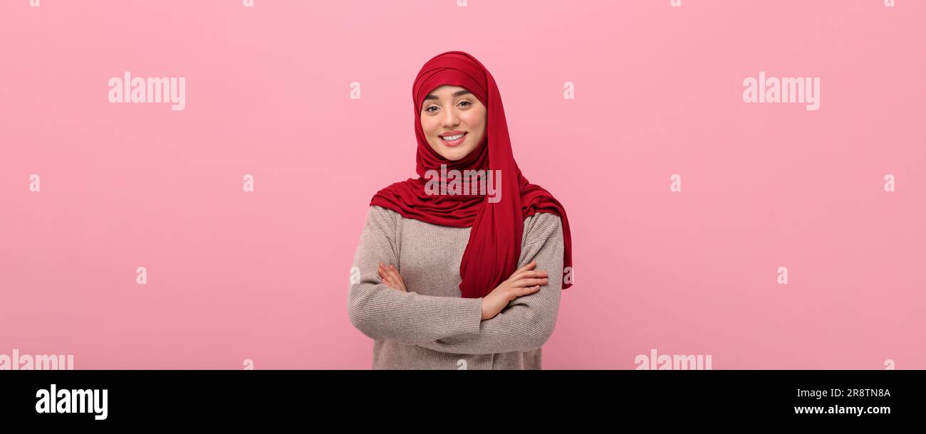 Portrait of Muslim woman in hijab on pink background. Banner design ...