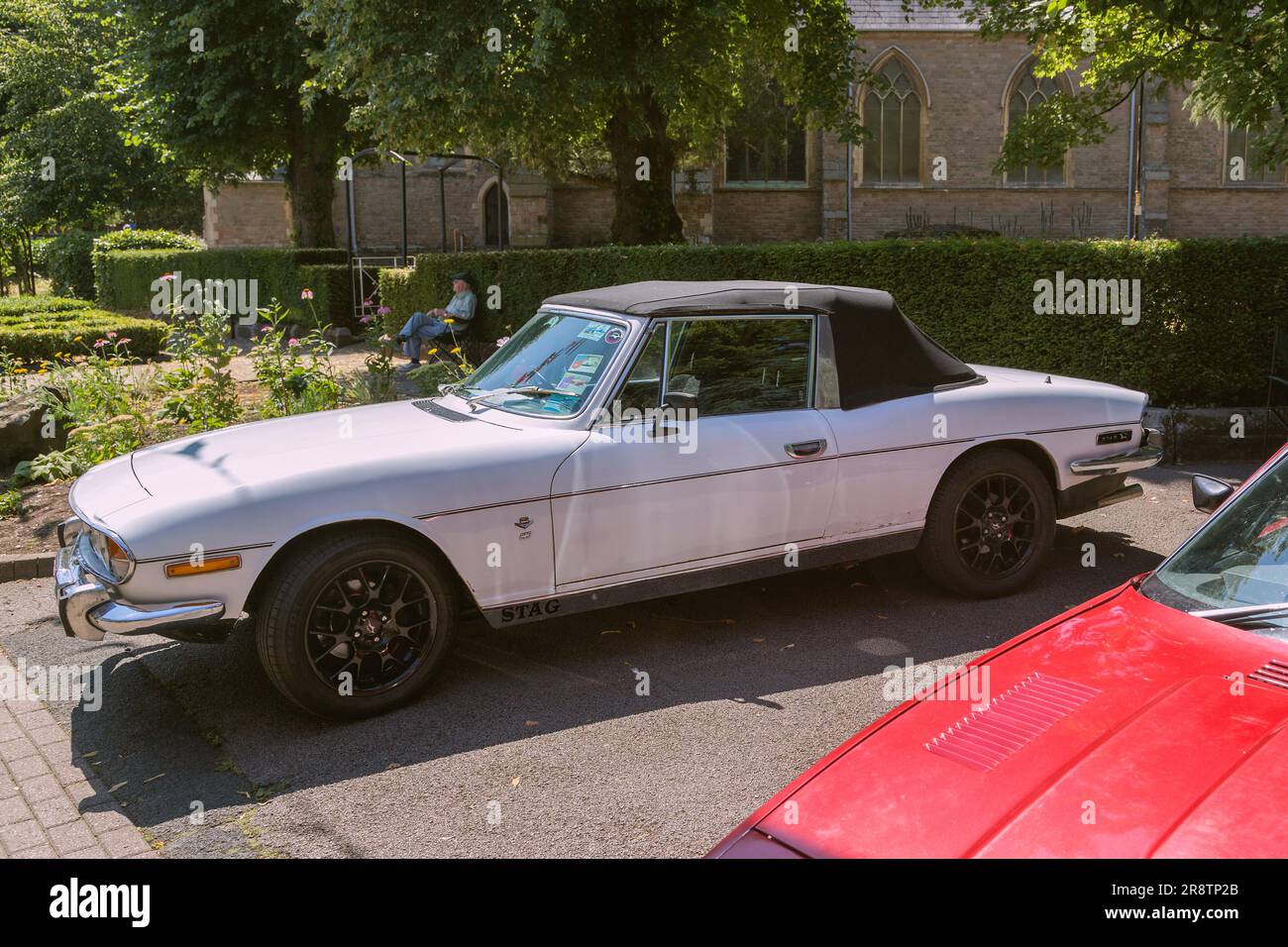 A white Triumph Stag, a 2+2 sports tourer which was sold between 1970 and 1978 by the Triumph Motor Company, a British car and motor manufacturer. Stock Photo