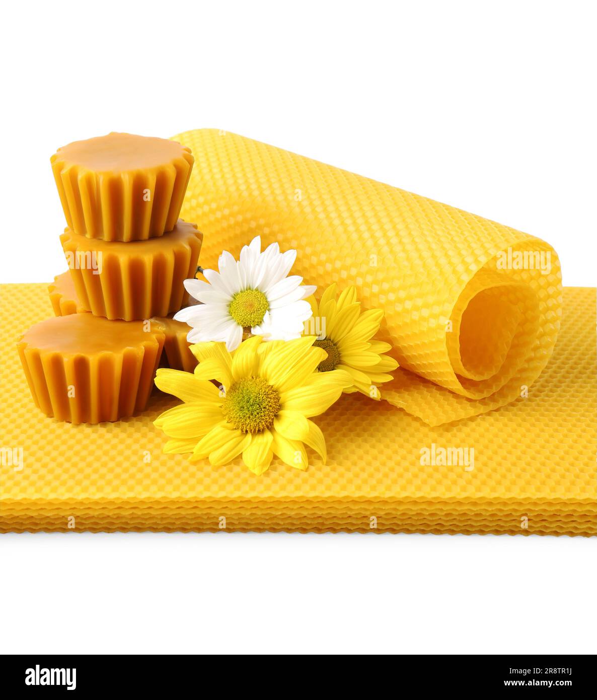 Natural beeswax cake blocks, flowers and sheets on white background Stock Photo