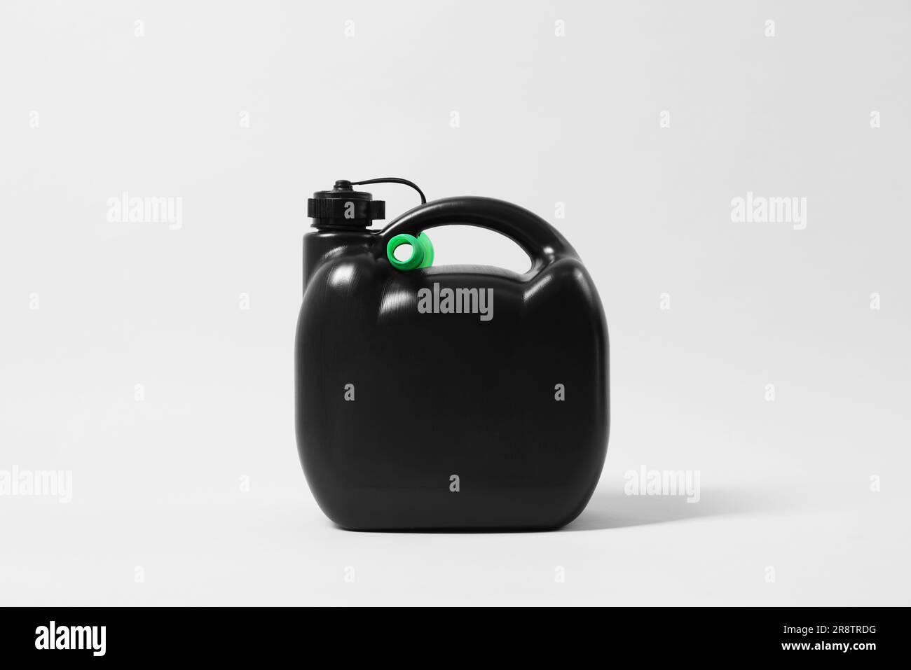 Black plastic canister with nozzle on light grey background Stock Photo