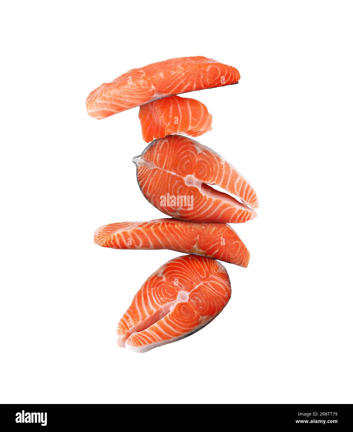 Cut fresh salmon falling on white background Stock Photo - Alamy