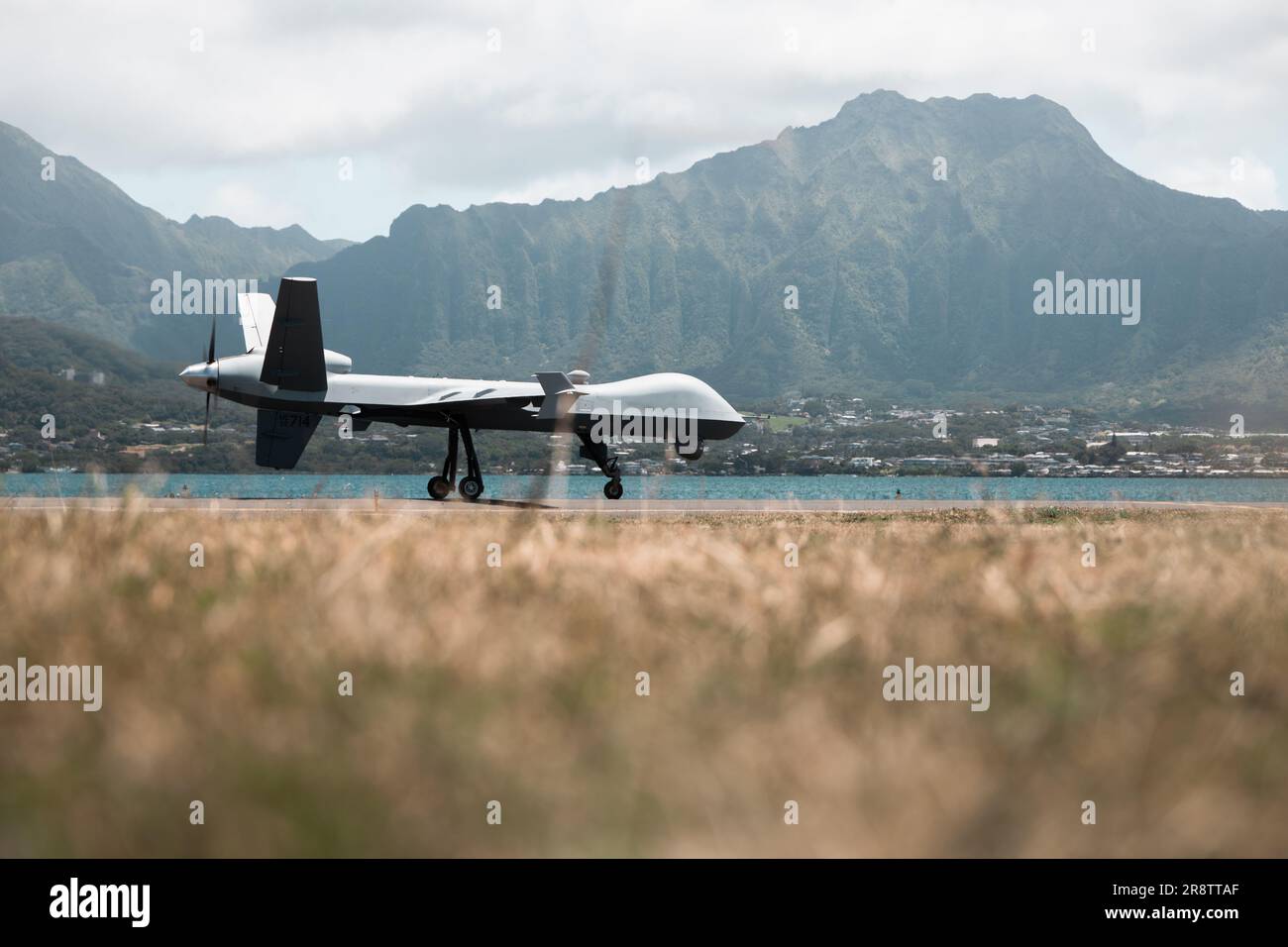 U.S. Marine Corps Marine Unmanned Aerial Vehicle Squadron (VMU) 3, Marine Aircraft Group 24, launches an MQ-9A on Marine Corps Air Station Kaneohe Bay, June 21, 2023. VMU-3, safely and successfully test and fly its first MQ-9A remotely piloted aircraft to meet the Naval Air Systems Command safety certification process. The Safe-For-Flight Operations Certification (SFFOC) is the final crucial milestone in VMU-3’s transition from the RQ-21A to the MQ-9A. (U.S. Marine Corps photo by Cpl. Christian Tofteroo). Stock Photo