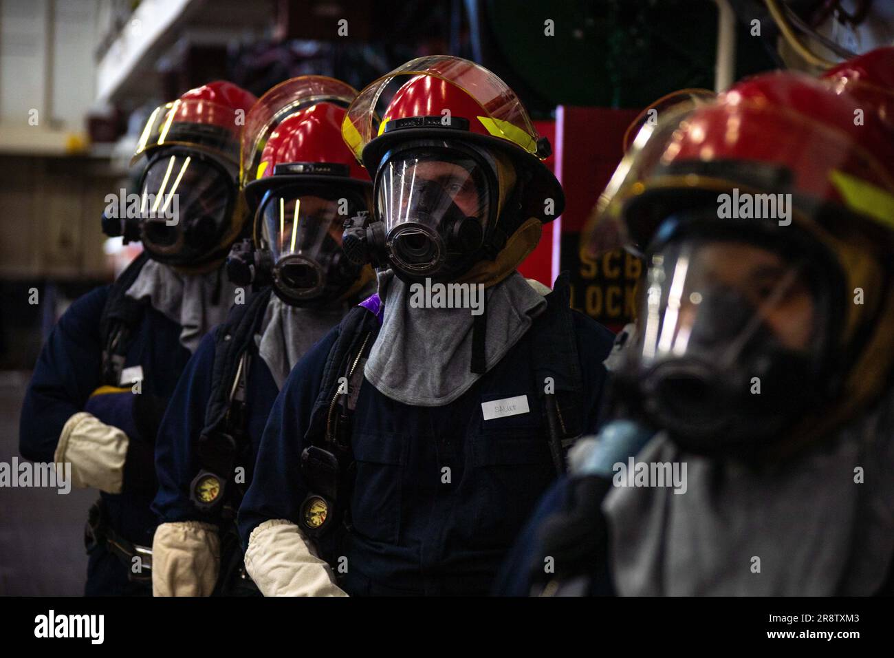 230614-N-XP477-2697 SAN DIEGO (June 14, 2023) – Sailors assigned to amphibious assault carrier USS Tripoli (LHA 7) responds to a simulated fire as part of a major fire drill during the ship’s maintenance availability June 14. The annual 8010 Chapter 13 major fire drill tested Tripoli’s Flying Squad, in-port emergency teams and medical department on their firefighting and medical response capabilities. The drill also evaluated national, regional and local emergency response from the Southwest Regional Maintenance Center, Naval Surface Forces Pacific Command, Naval Base San Diego, and local fire Stock Photo