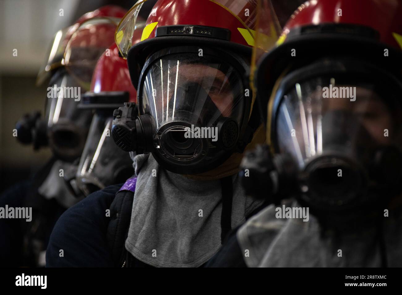 230614-N-XP477-2734 SAN DIEGO (June 14, 2023) – Sailors assigned to amphibious assault carrier USS Tripoli (LHA 7) responds to a simulated fire as part of a major fire drill during the ship’s maintenance availability June 14. The annual 8010 Chapter 13 major fire drill tested Tripoli’s Flying Squad, in-port emergency teams and medical department on their firefighting and medical response capabilities. The drill also evaluated national, regional and local emergency response from the Southwest Regional Maintenance Center, Naval Surface Forces Pacific Command, Naval Base San Diego, and local fire Stock Photo