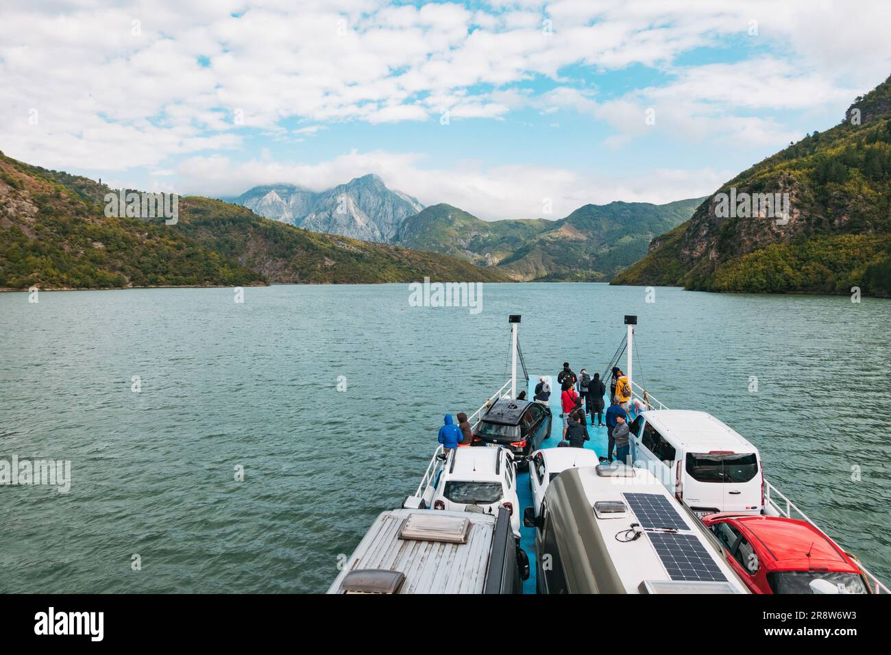a ferry carries vehicles and passengers across Lake Koman, a large reservoir constructed on the Drin River in northern Albania. Stock Photo