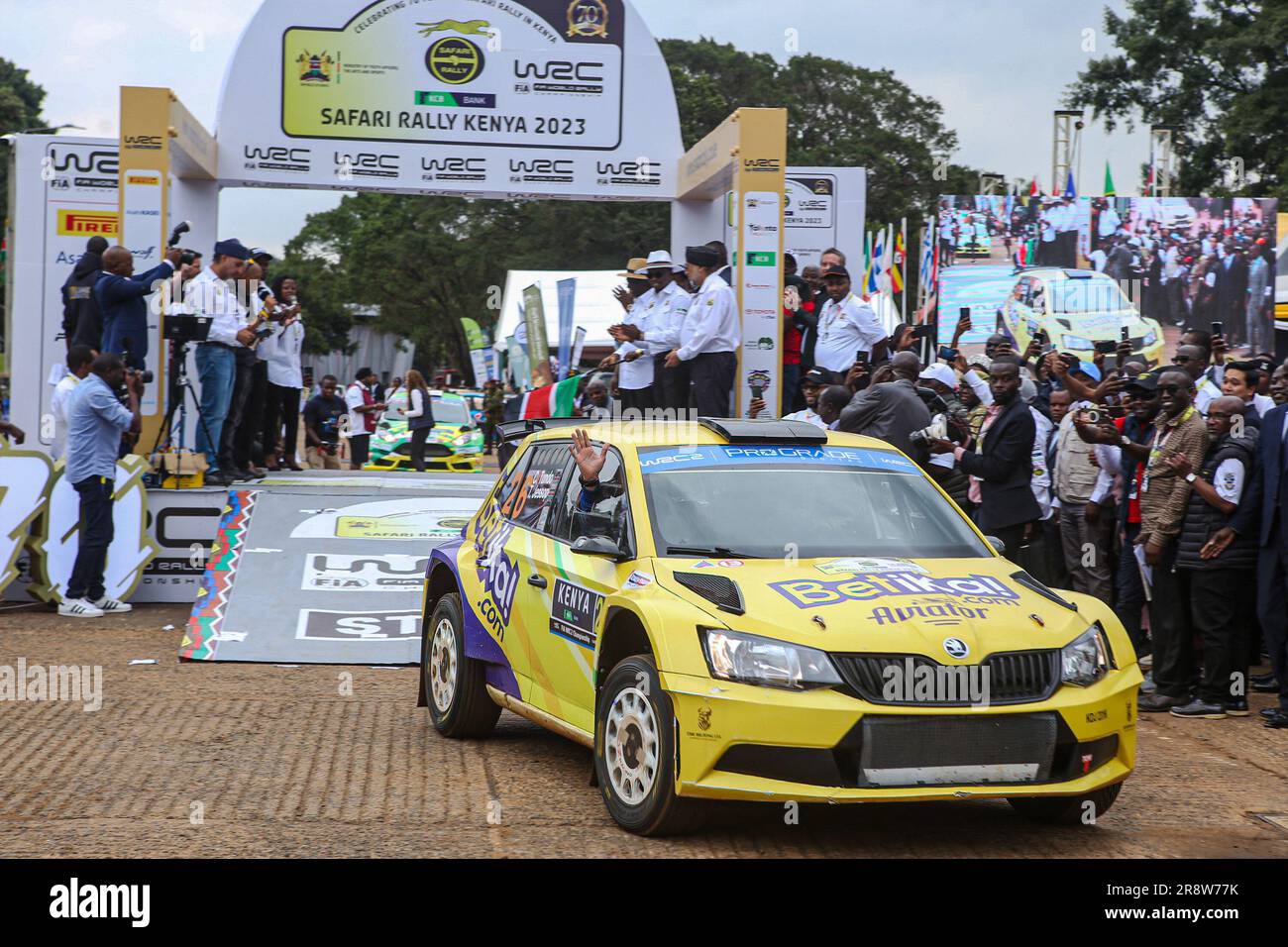 Kenyan driver Carl Tundo and codriver Jessop Tim driving Škoda Fabia R5 wave to the crowd