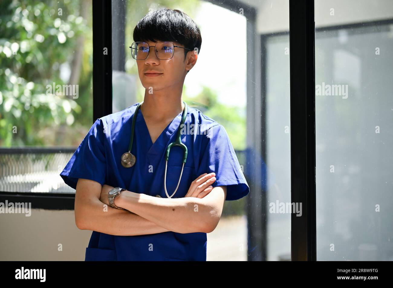 A positive and smart young Asian male doctor or medical student in ...