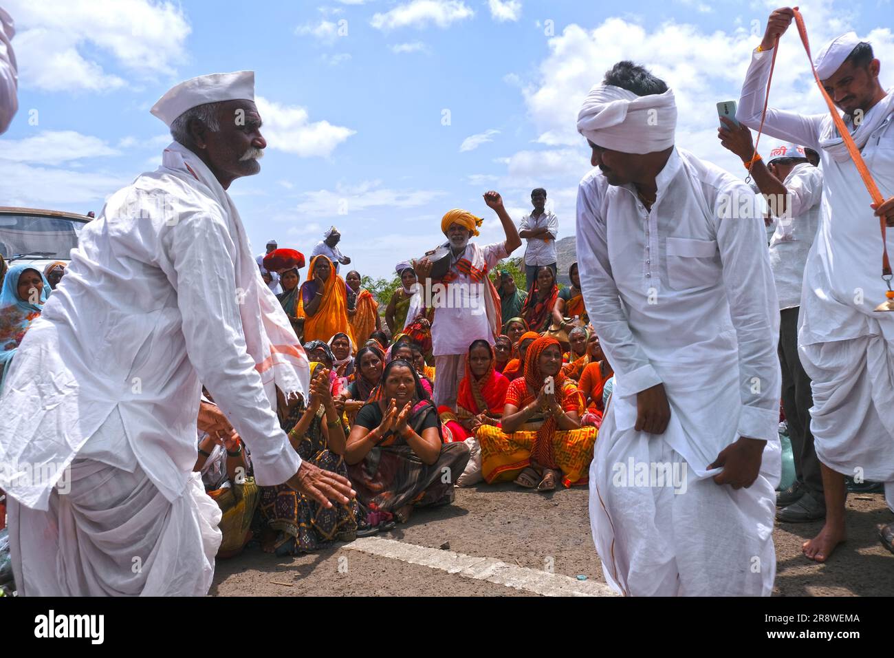 Pune, India 14 July 2023, cheerful Pilgrims at Palkhi, During Pandharpur wari procession Pilgrims marching toward Vitthala temple with singing. Stock Photo