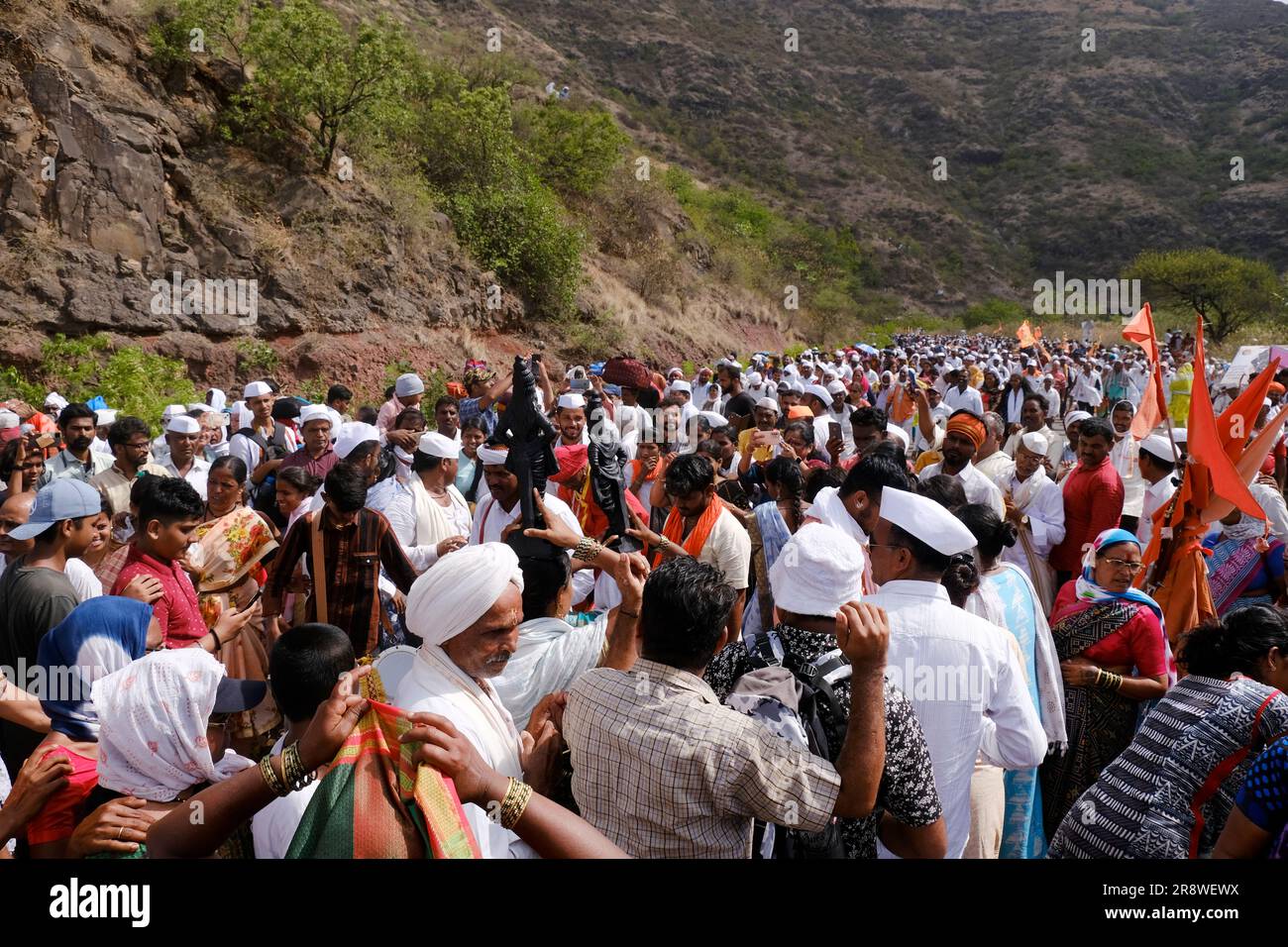 Pune, India 14 July 2023, cheerful Pilgrims at Palkhi, During Pandharpur wari procession Pilgrims marching toward Vitthala temple with singing. Stock Photo