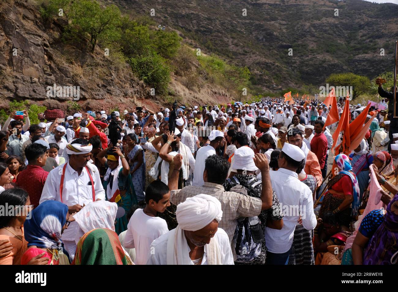 Pune, India 14 July 2023, cheerful Pilgrims at Palkhi, During Pandharpur wari procession Pilgrims marching toward Vitthala temple with singing. Stock Photo