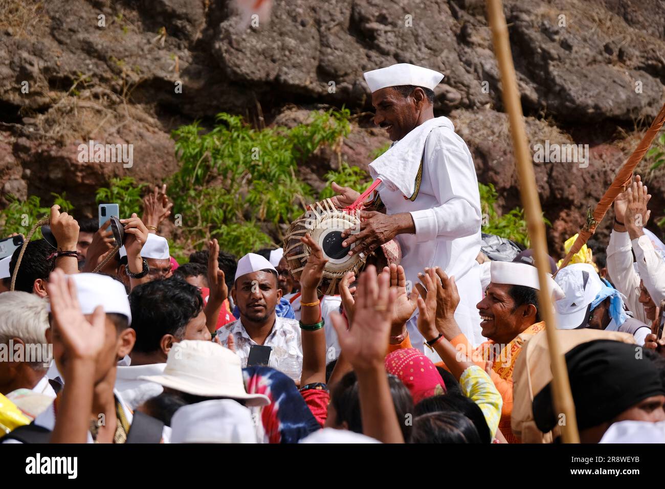 Pune, India 14 July 2023, cheerful Pilgrims at Palkhi, During Pandharpur wari procession Pilgrims marching toward Vitthala temple with singing. Stock Photo