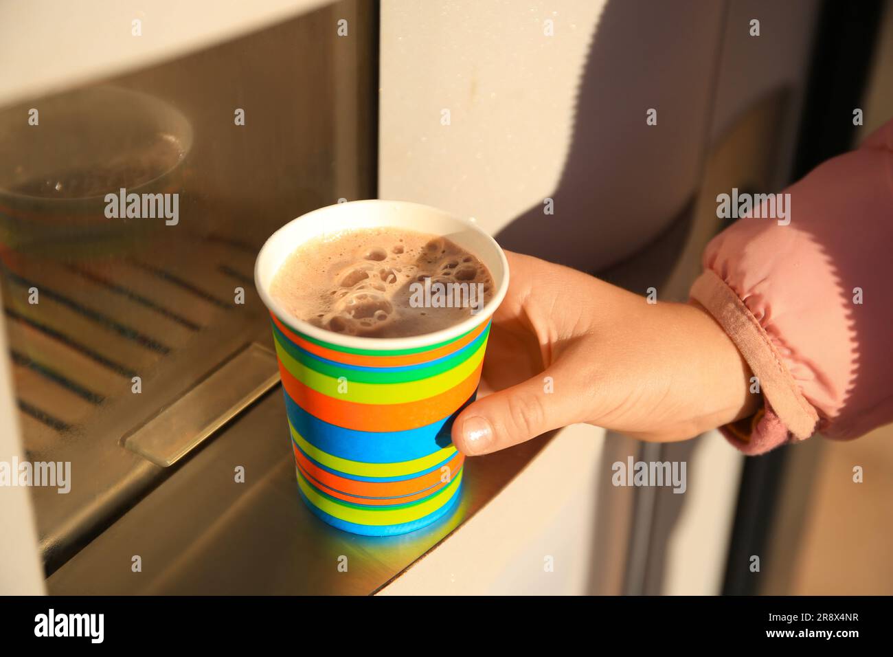 Woman taking paper cup with coffee from vending machine, closeup Stock ...