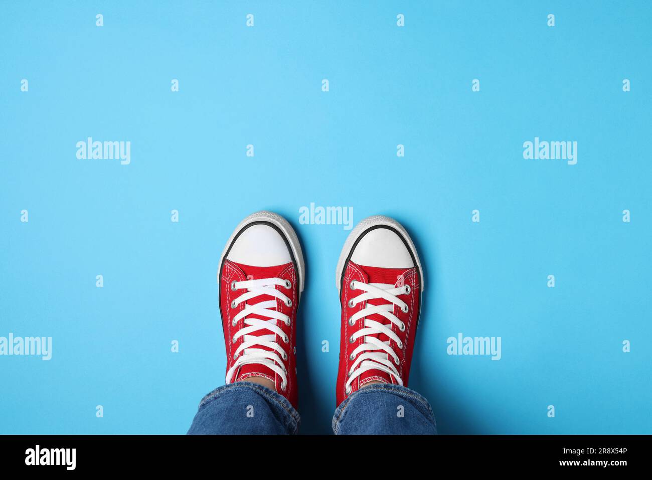Wearing red top and blue jeans hi-res stock photography and images - Alamy