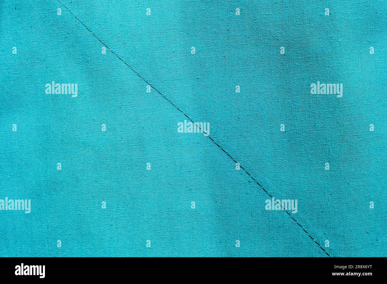 Blue fabric texture. Medical texture. Blue background. Surgical drape.. Closeup Image Of Blue