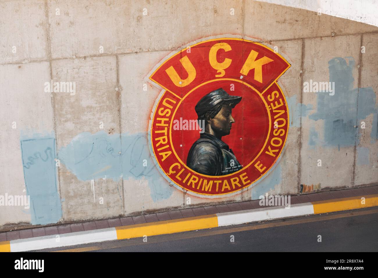 the ensign of the Kosovo Liberation Army, painted on a highway wall in the city of Ferizaj, Kosovo Stock Photo