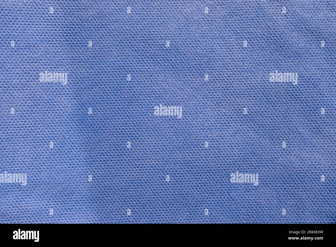 Blue fabric texture. Medical texture. Blue background. Surgical drape.. Closeup Image Of Blue