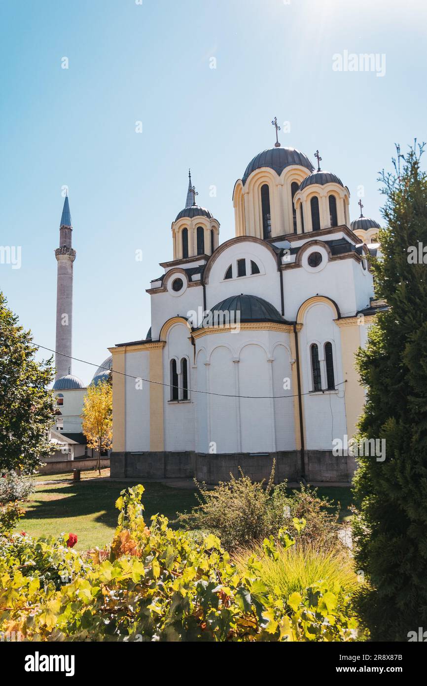 The Great Mosque and Serbian Orthodox St. Uroš Cathedral, which famously neighbor each other in the center of the city of Ferizaj, Kosovo Stock Photo
