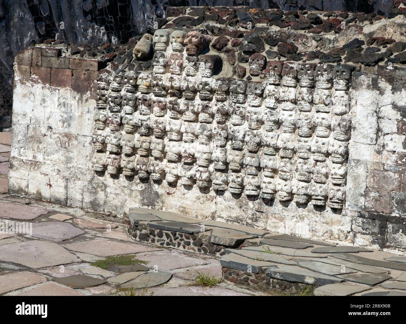 Wall of stone skulls called Tzompantli, archaeological site and museum