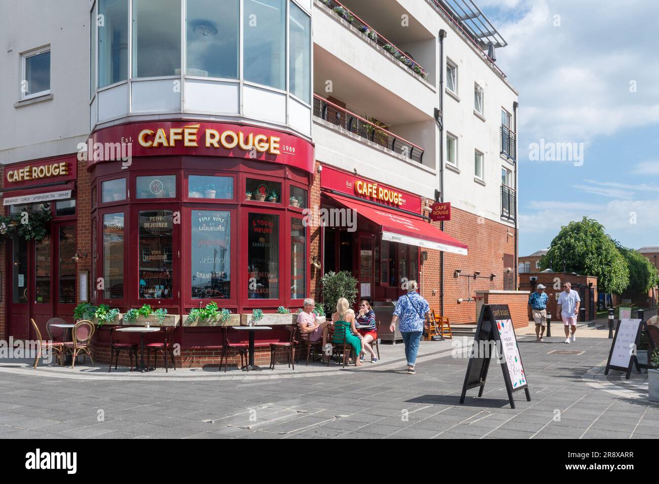 Cafe Rouge French-style restaurant with people sitting outside at Gunwharf Quays, Portsmouth, Hampshire, England, UK, on a sunny summer day Stock Photo