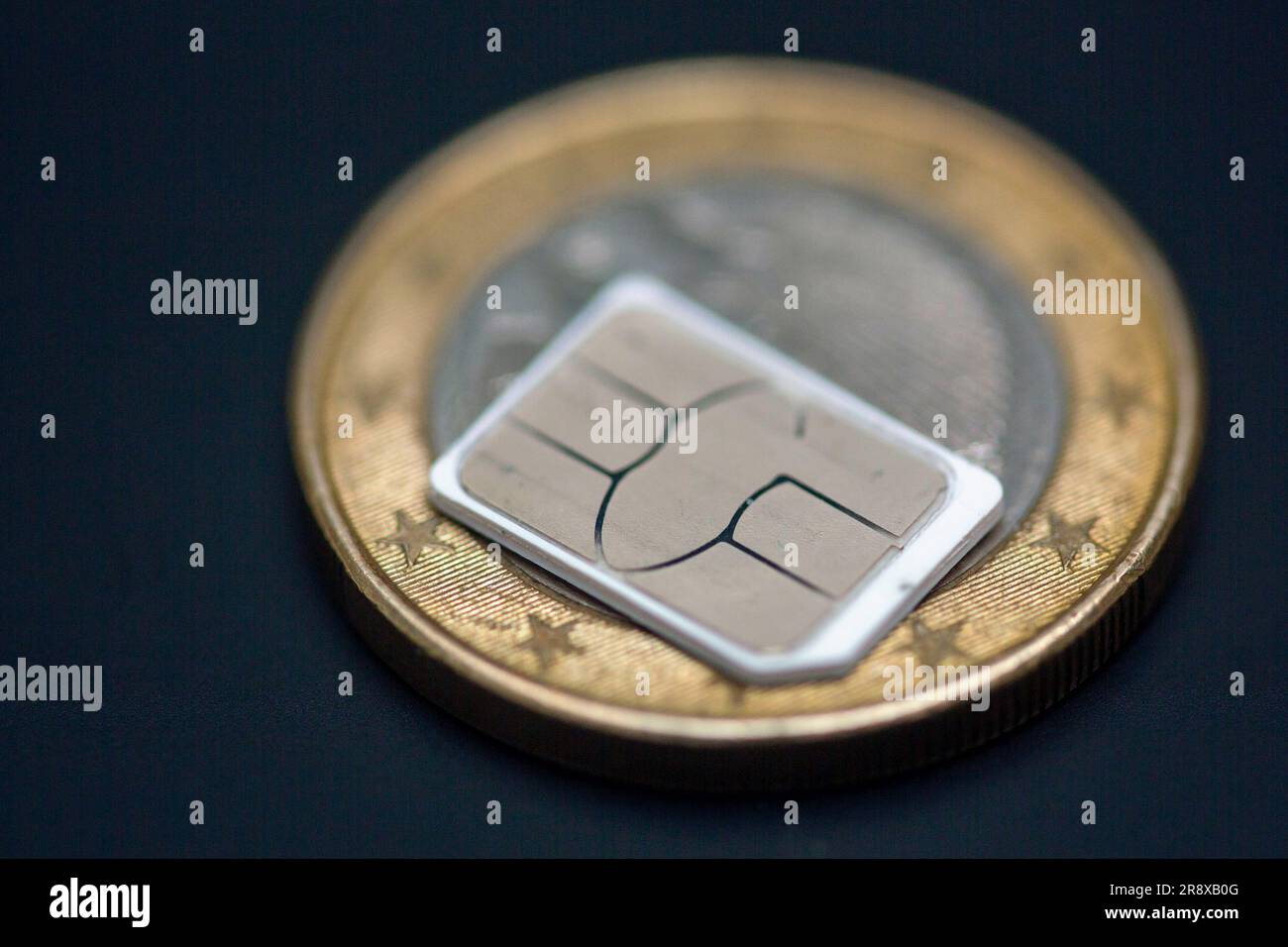 Berlin, Germany. 22nd June, 2023. A SIM card lies on a 1euro coin