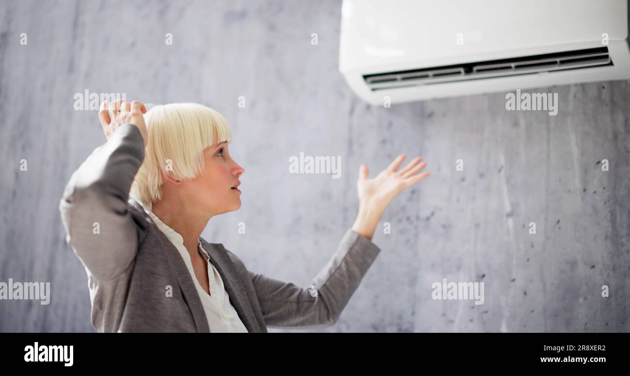Sick Woman Having Cold And Sore Throat From Air Conditioner Stock Photo