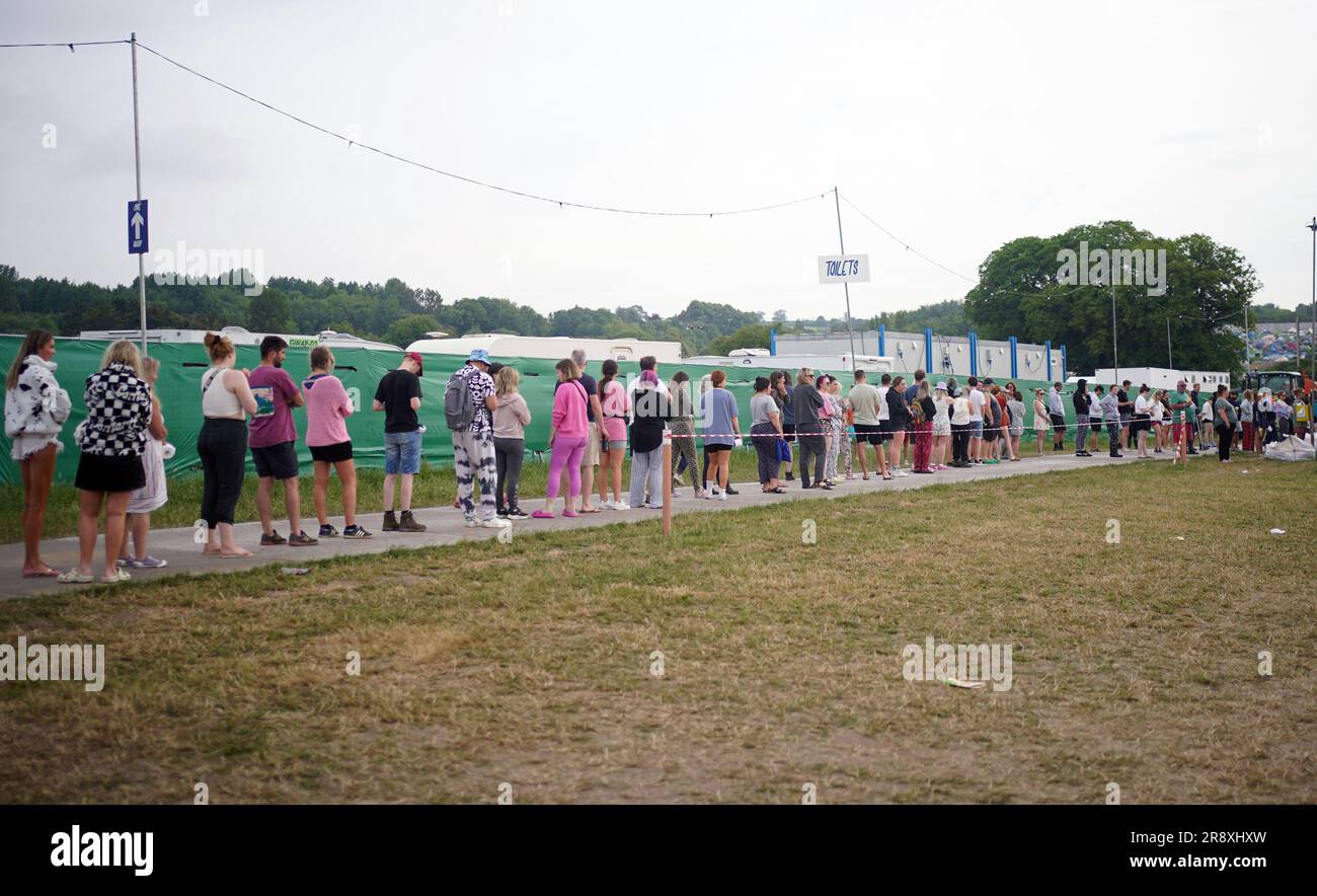 People queue for the toilets at the Glastonbury Festival at Worthy Farm ...