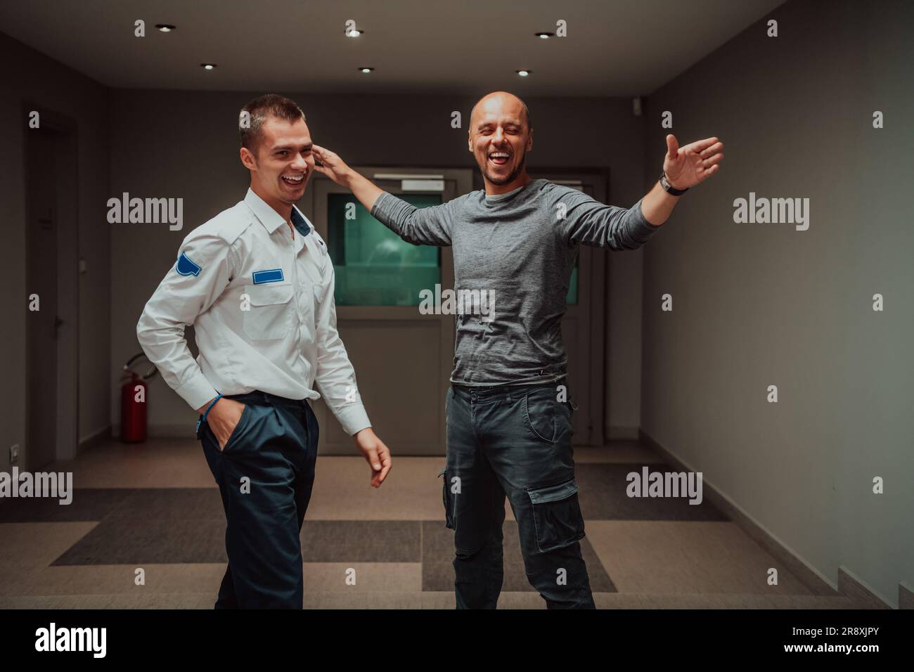 Security guard making body searching procedure on man for finding