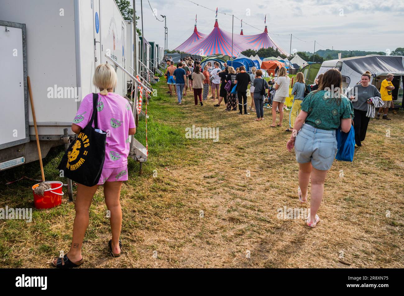 Glastonbury, UK. 23rd June, 2023. The queue for the showers builds up