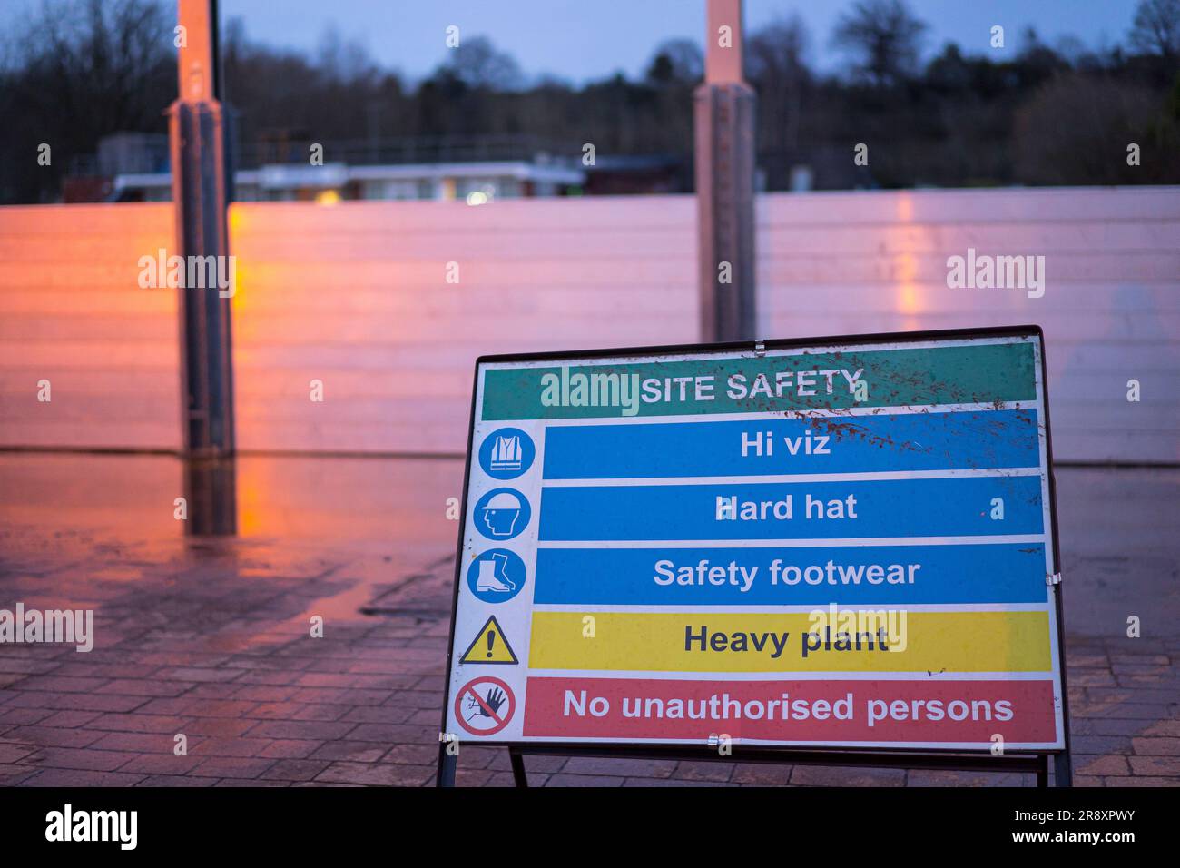 Floor standing Site Safety road sign in front of flood defense barriers, Bewdley, Worcestershire, UK. Stock Photo