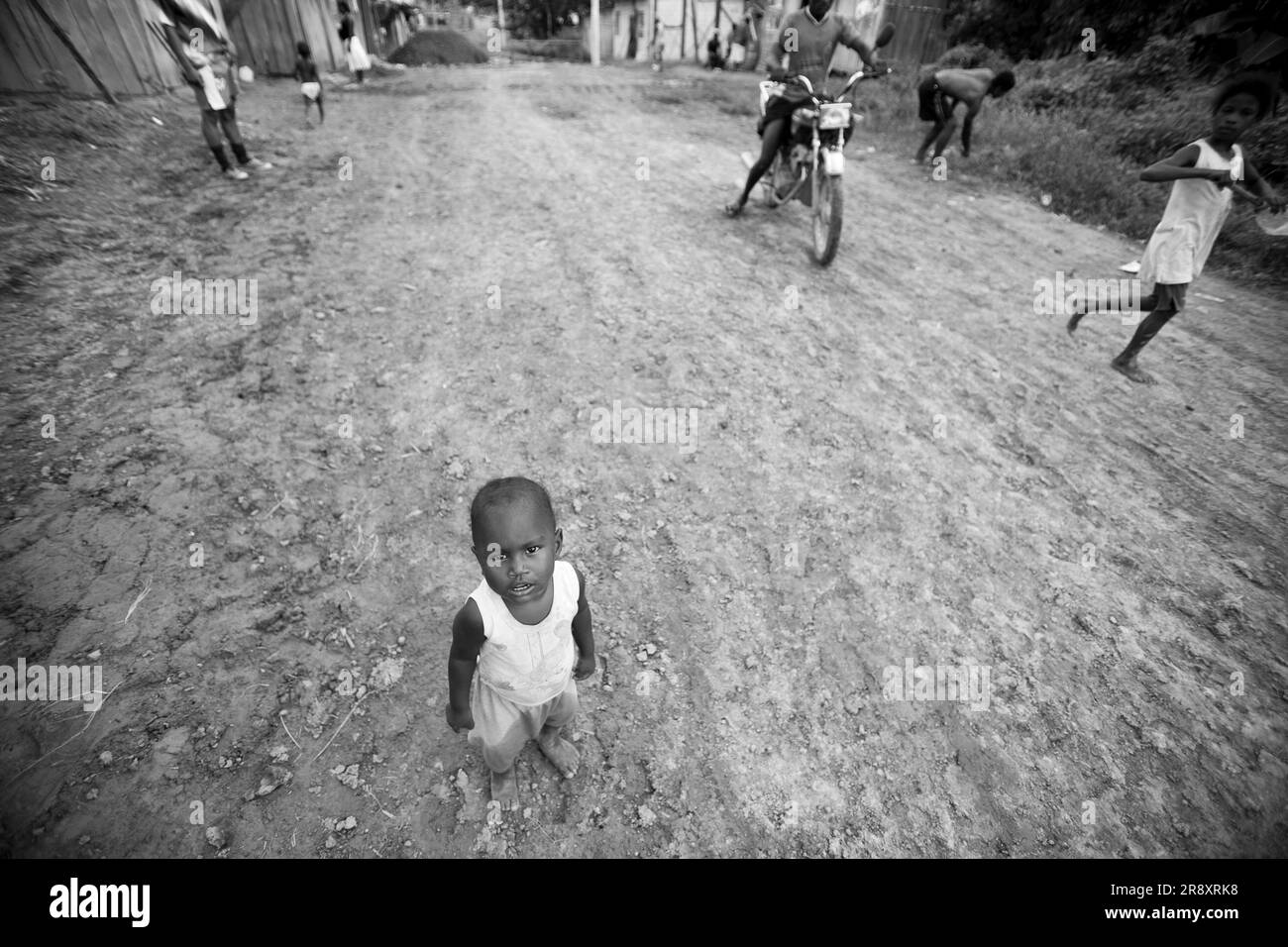 A twoyearold refugee child in the pebbled road of San Mart'n, Ecuador