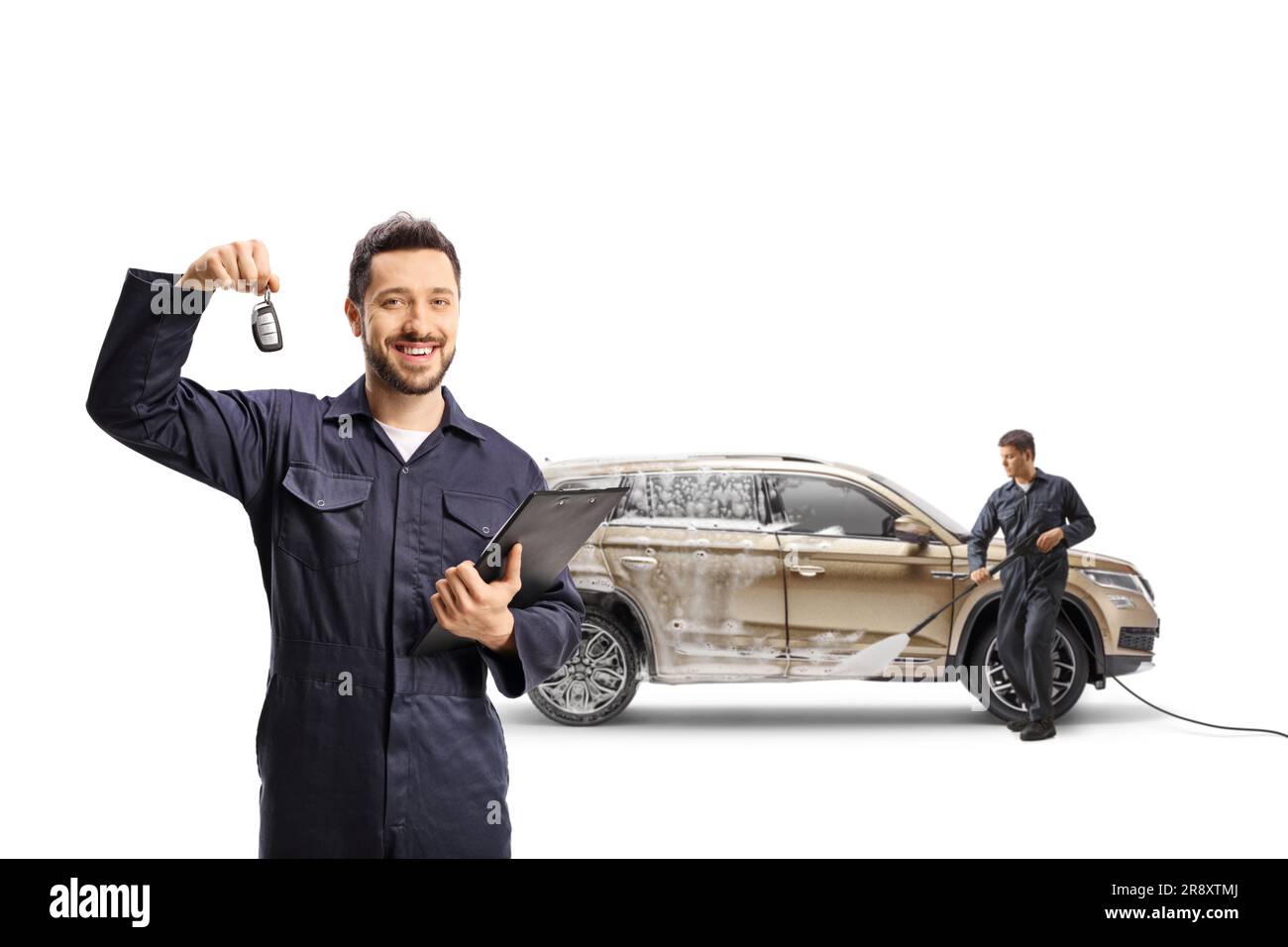 Workers cleaning a SUV at a car wash and holding a car key isolated on white background Stock
