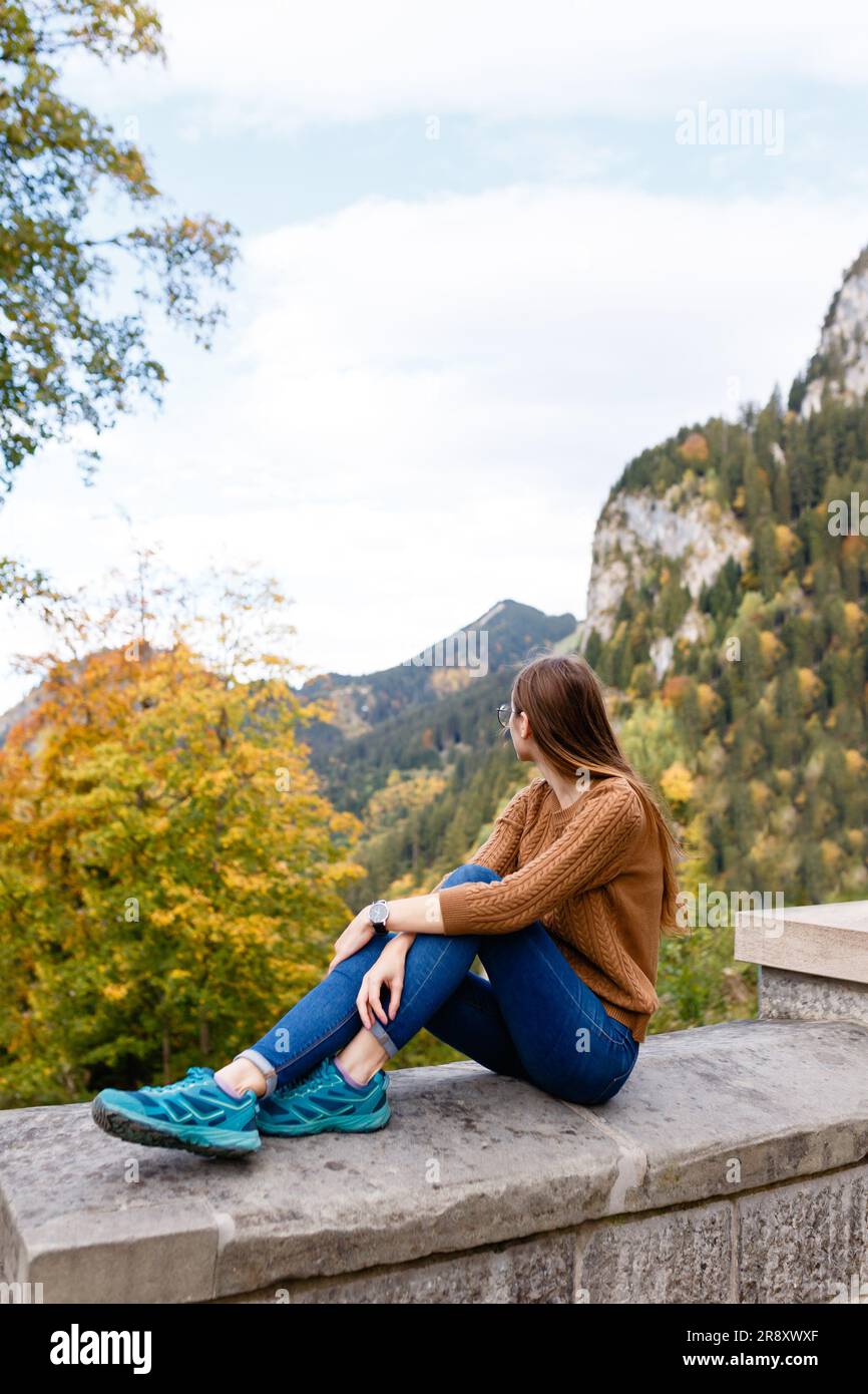 young female tourist on  alpine mountains and forests in Austria Stock Photo