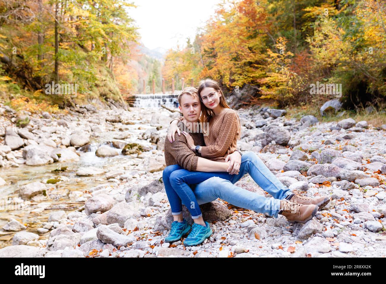 man and a woman embrace in nature near the river Stock Photo