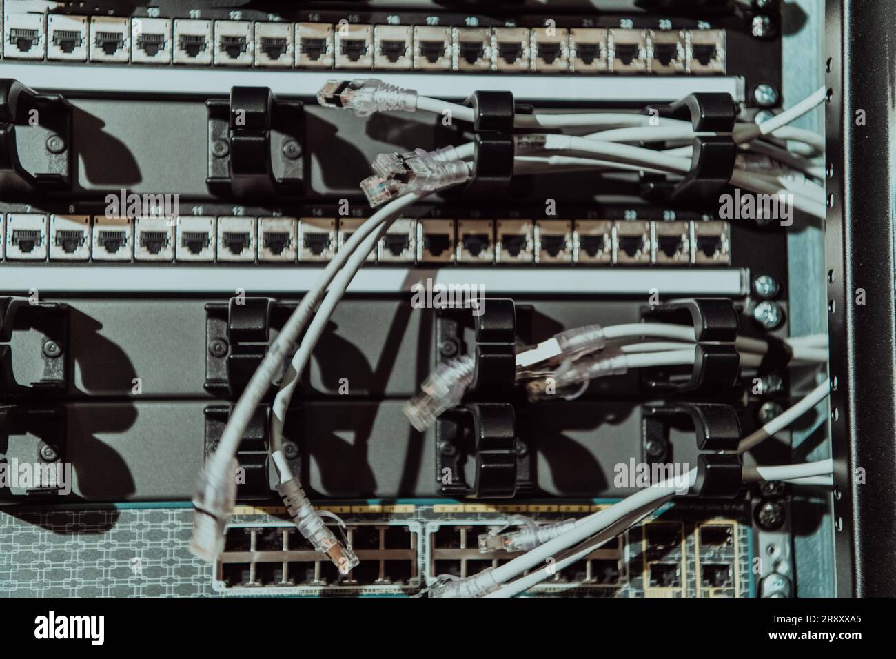 Close up of technician setting up network in server room  Stock Photo